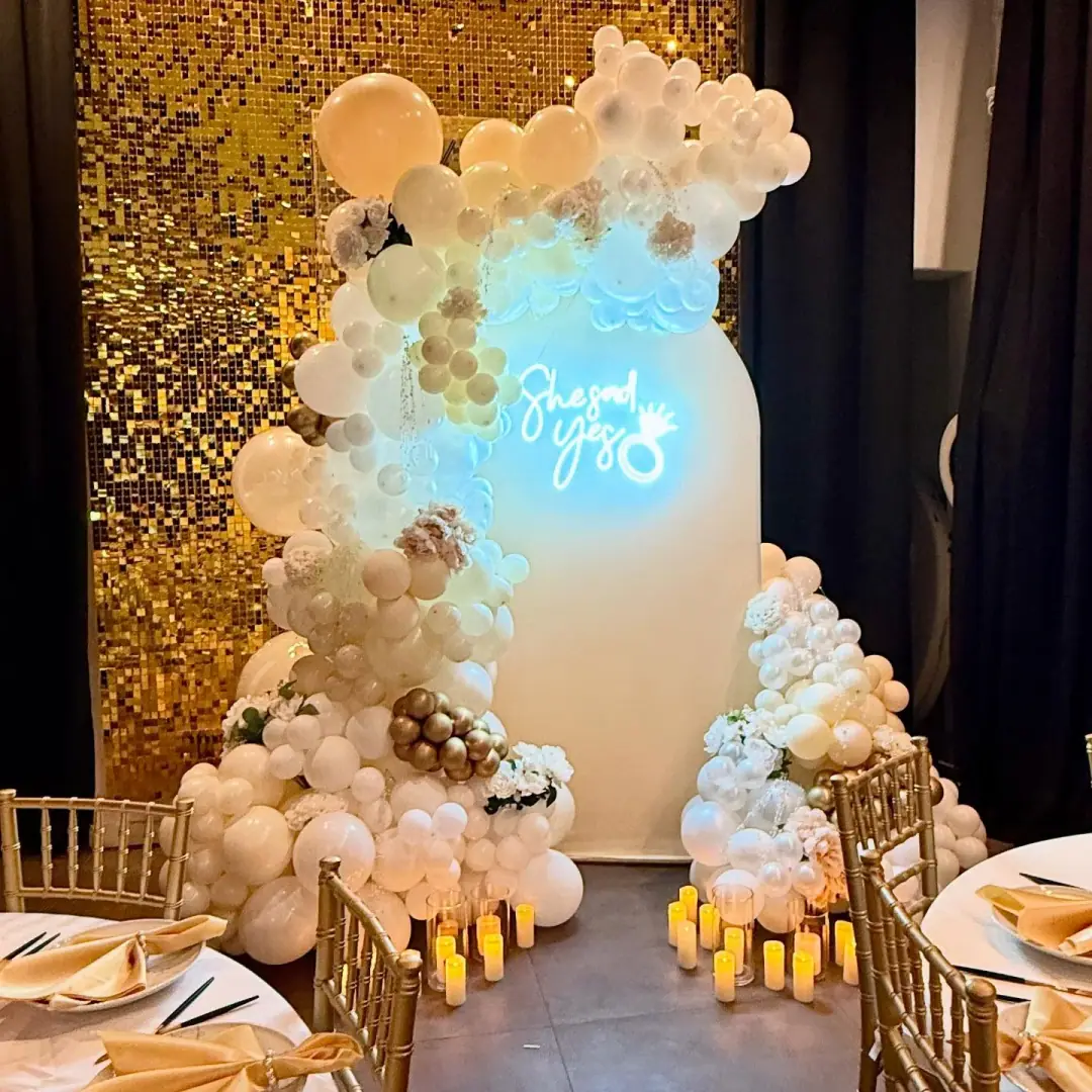 Elegant white and gold balloon setup for a romantic celebration