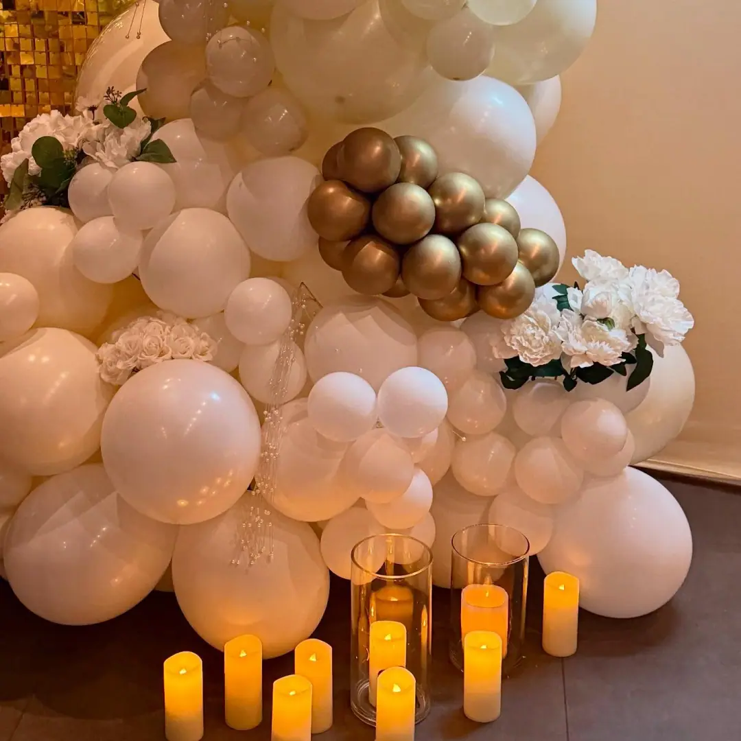 Romantic balloon décor with candlelight and golden accents