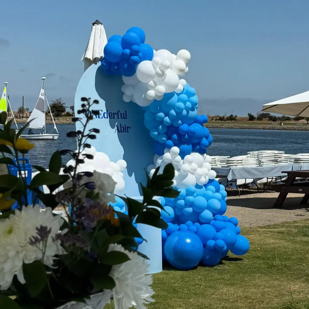 Custom arch and balloon garland for a first birthday by the bay