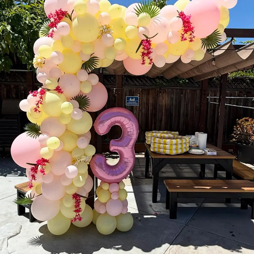 Pastel balloon garland for a milestone kids birthday party
