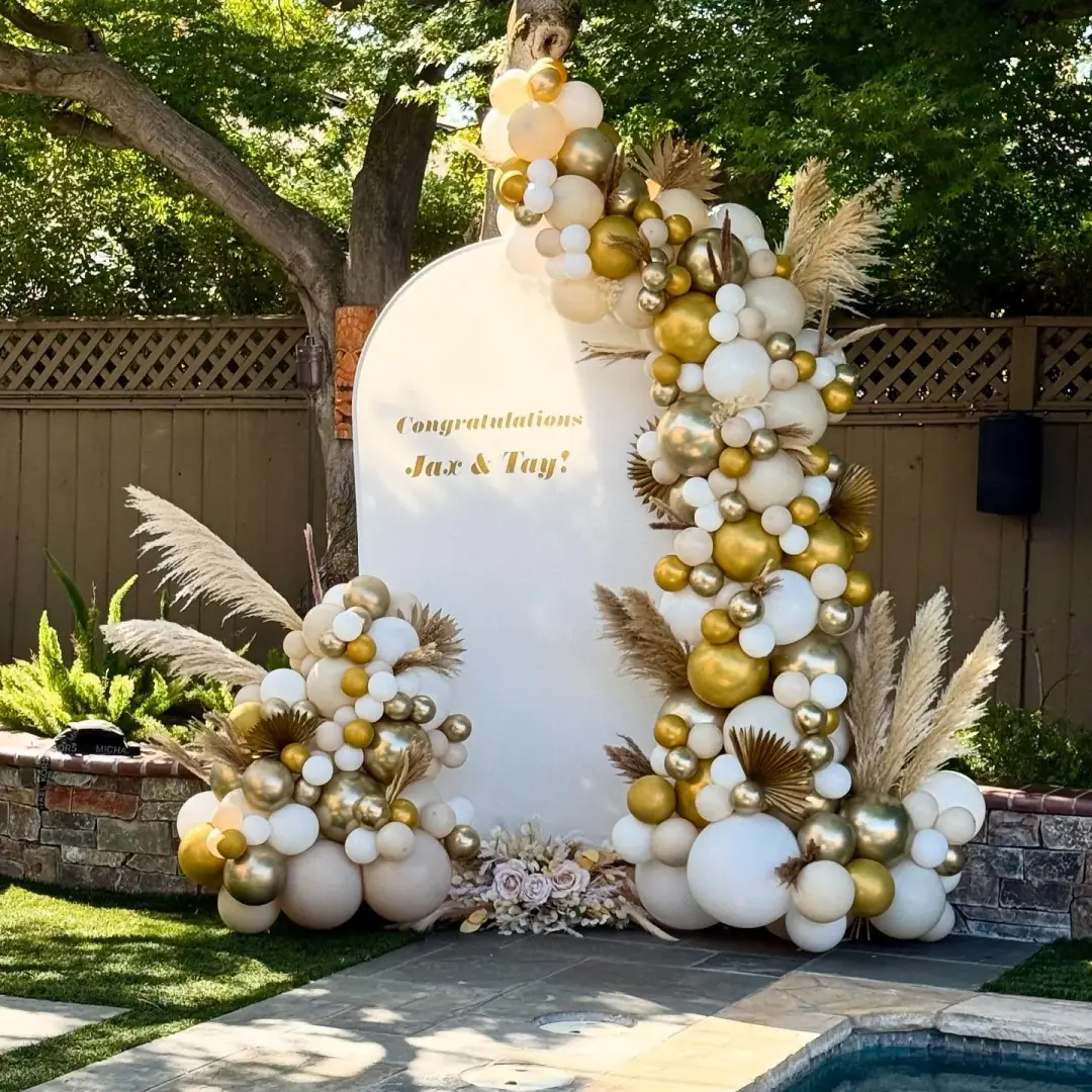 Luxury balloon décor with ivory tones and golden accents