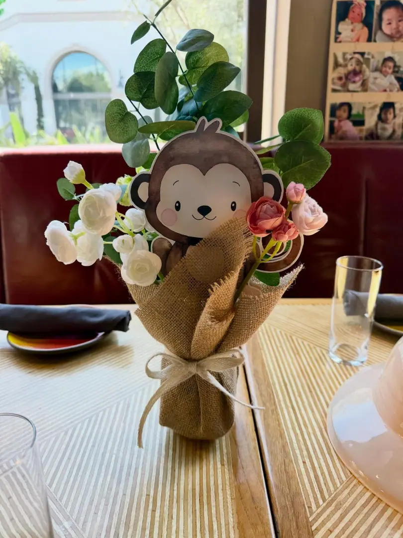 Animal-themed balloon centerpiece built for a children's party table