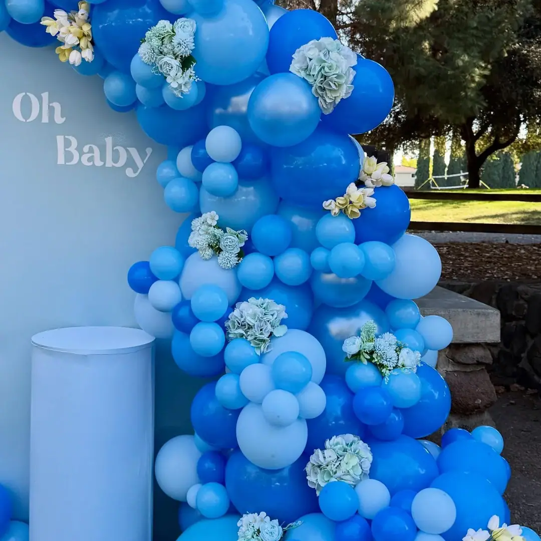 Blue organic balloon garland with floral accents for a Bay Area event
